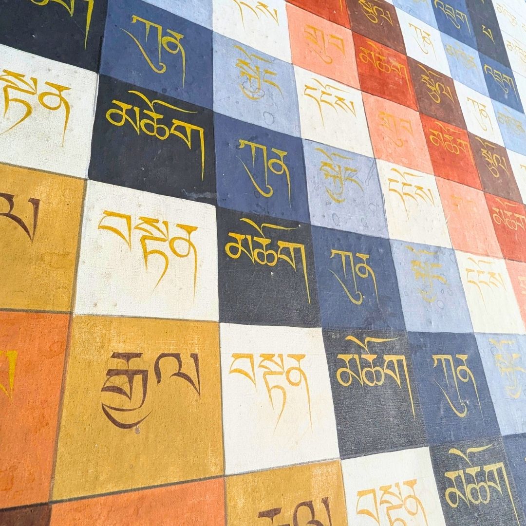 Colorful fabric with printed text in a grid pattern